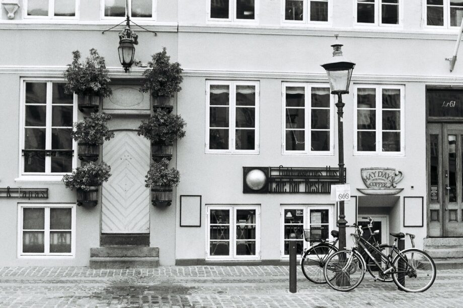 A bicycle parked in front of a building.